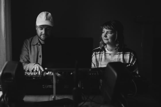 Mike and Mairearad at their synthesisers, in black and white