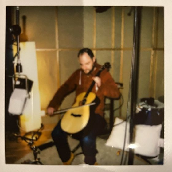 Mike bowing a tenor guitar, Gloworm Studio 1